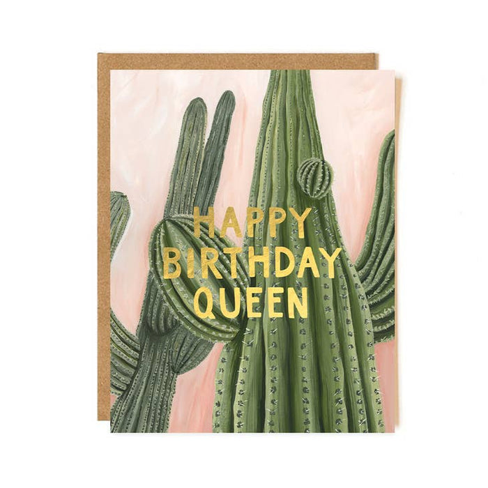 Cactus birthday card with gold text Happy Birthday Queen and a kraft envelope behind.