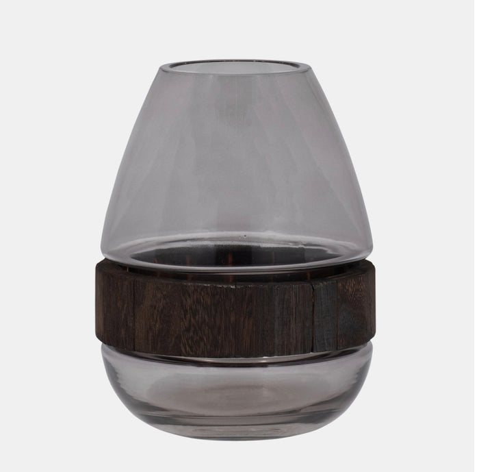 A clear glass cylinder vase with a wooden band around the middle.