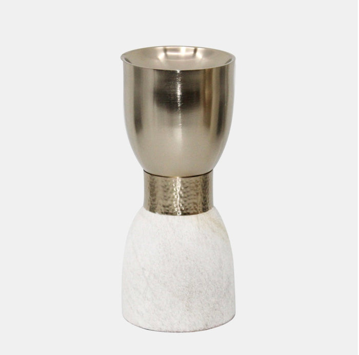 A metal candleholder with a silver upper part and a white/gold lower part, possibly a hair on hide material.