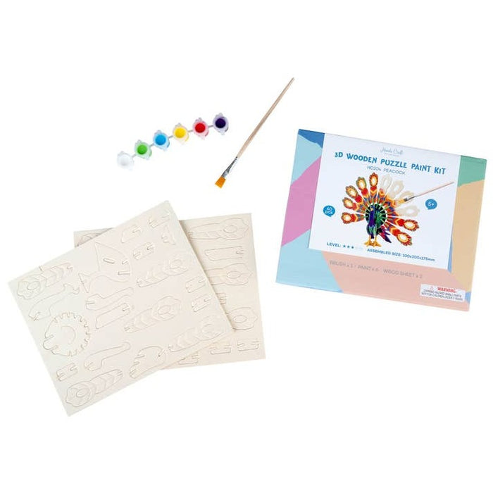 Kit contents include blank wooden puzzle sheets, paint pots, and a brush beside the box