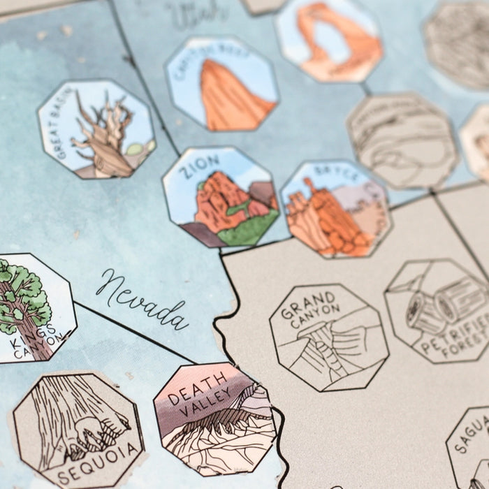 Section of the 63 US National Parks Scratch Off map with illustrated park icons across a map