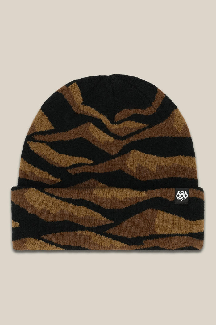 The 686 Summit Beanie features a brown and black tiger stripe knit, a small white 686 logo on the cuff, and is shown on a beige background‚Äîperfect for your next adventure.