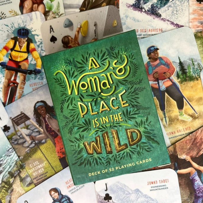 Green forest themed deck of 52 playing cards titled A Woman s Place Is in the Wild