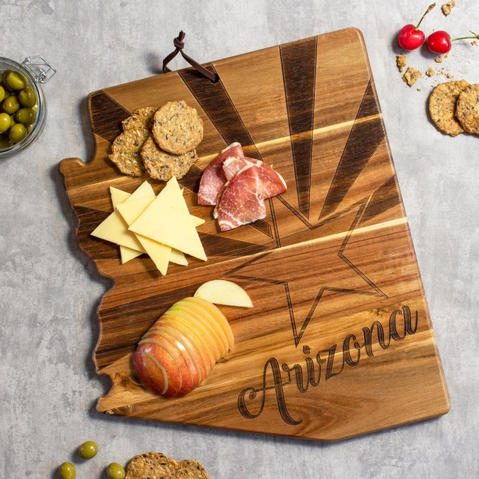 Arizona flag serving board styled as a charcuterie board with cheeses olives crackers and salami