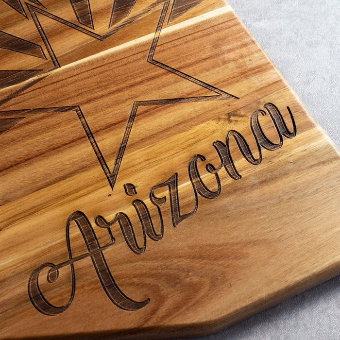 Close up of Arizona flag serving board with carved star and the Arizona script