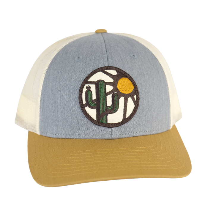 Blooming Saguaro Low Profile Curved Trucker Birch front view with light blue front panel, cream mesh, tan brim and cactus sun patch