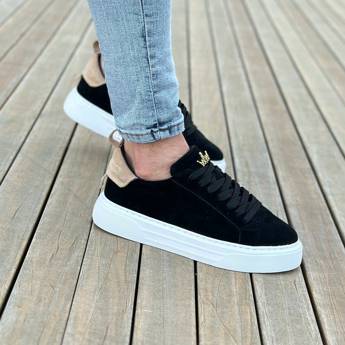 Martin Valen Bobe suede sneakers in taupe and black, side-angle on foot with white platform sole and gold logo