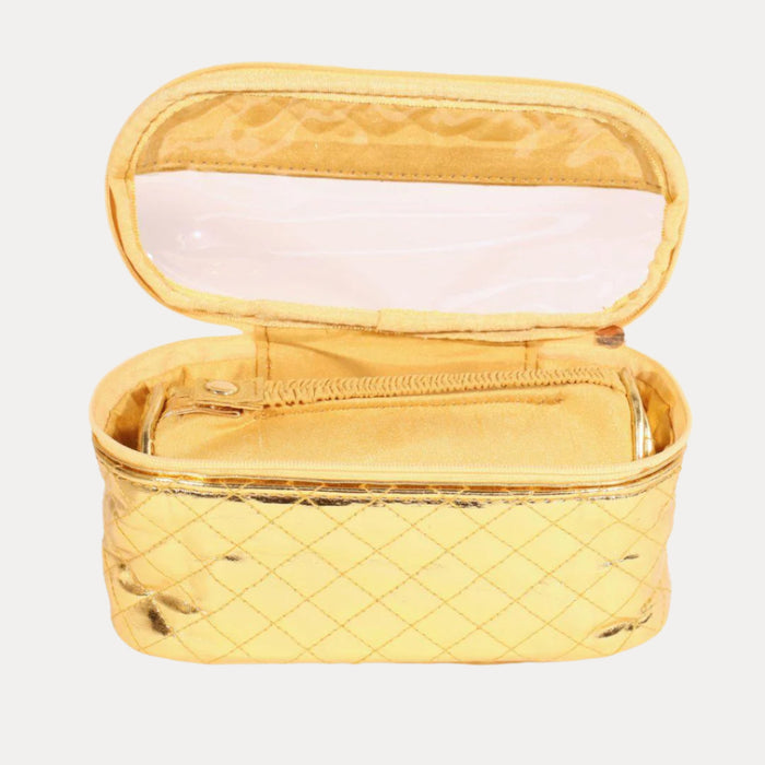 a gold cosmetic bag with a zipper