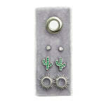 Cactus Stud Gift Set on gray display featuring diamond studs, green cactus charms, and sunburst earrings