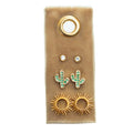 Cactus Stud Gift Set on brown display with diamond studs, green cactus charms, and gold sunburst earrings