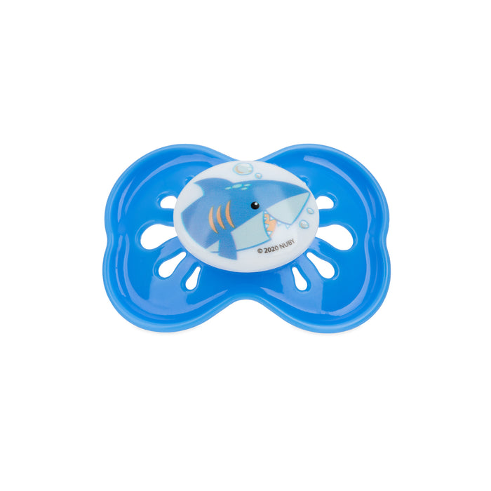 The Classic Oval Pacifier is a large, blue silicone pacifier with a shark illustration, decorative holes, and a symmetrical butterfly shape. It features a hygienic air system to help soothe fussy babies.