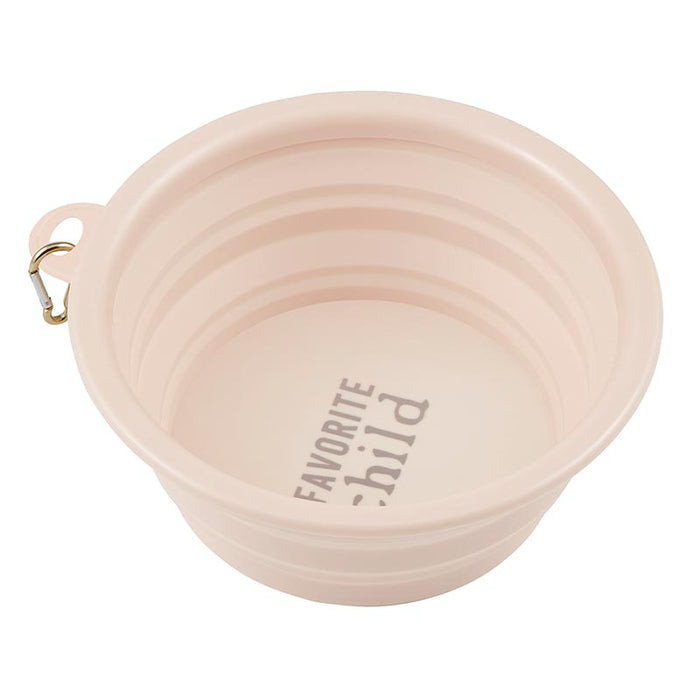 Open collapsible pale pink bowl with ribbed sides and Favorite Child printed on the interior.