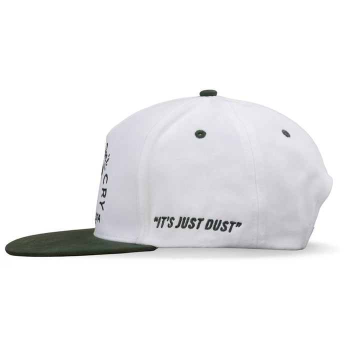 White Cowboys Don't Cry flat brim hat with a green brim and embroidery reading it's just dust on the side
