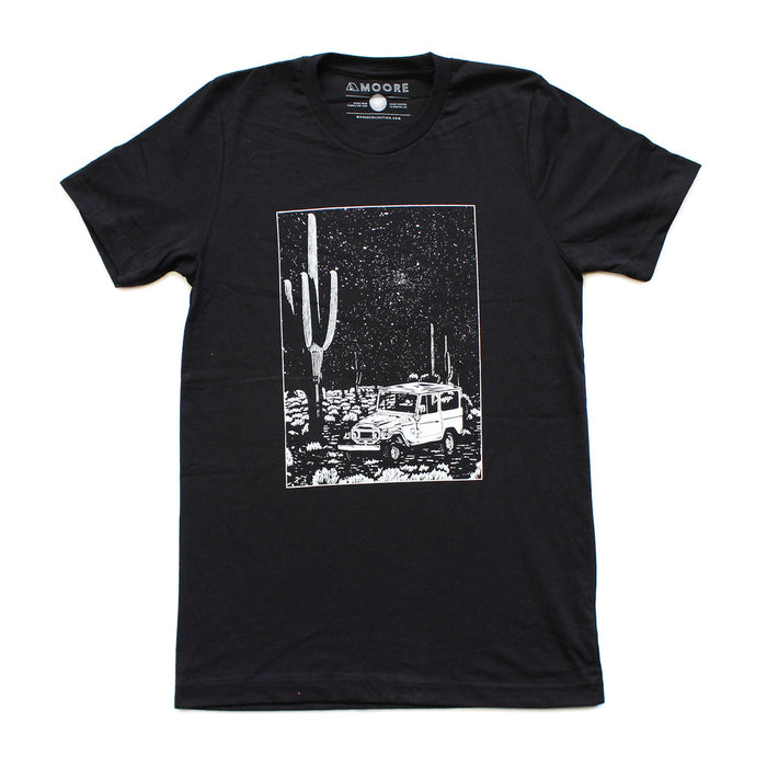 Black tee with a white rectangular desert scene graphic showing a jeep and cacti.