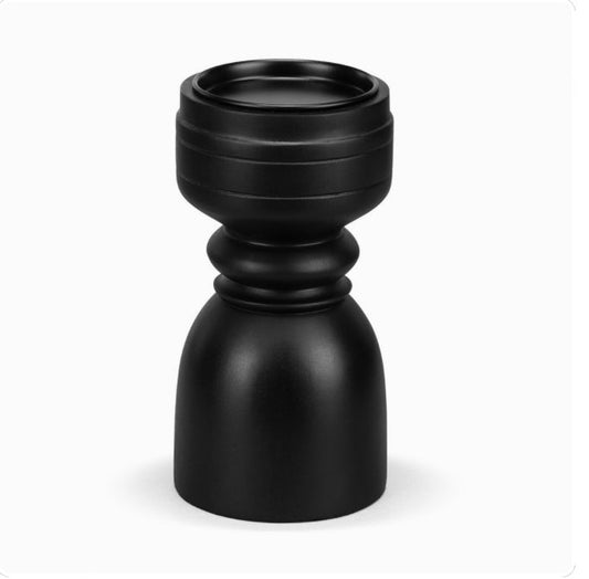 A large black ebony wood pillar candle holder.