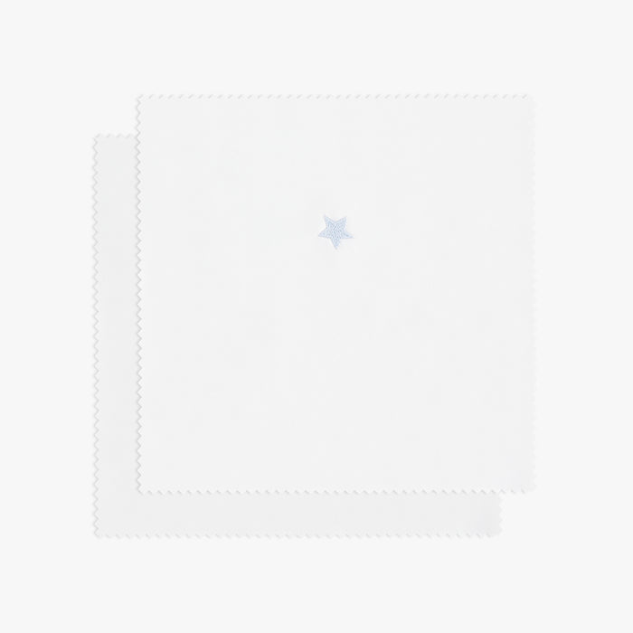 White swatch with blue star embroidery.