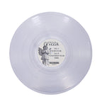 A translucent Hush Clear vinyl from Fifteen with a central angel-illustrated label reading FIFTEEN and track names: SURVIVOR, ANOTHER YEAR, and MRR.