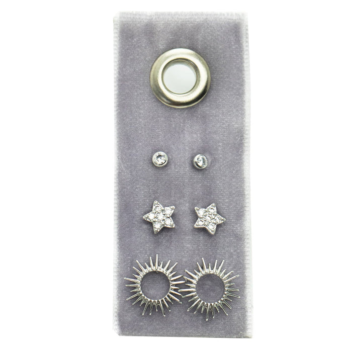Flower Stud Gift Set on grey velvet shows a large round gold stud at top, two small crystal studs, two star crystal studs, and sunburst earrings