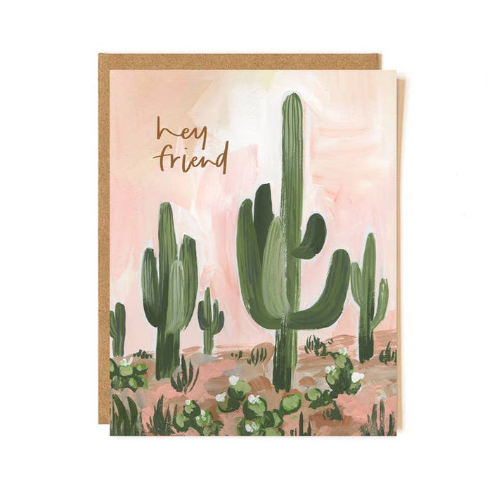 Hey Friend cactus greeting card with pastel pink desert scene and kraft envelope behind