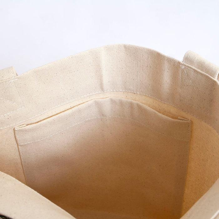 Interior view of Tarot Tote Bag in natural canvas showing a stitched inner pocket