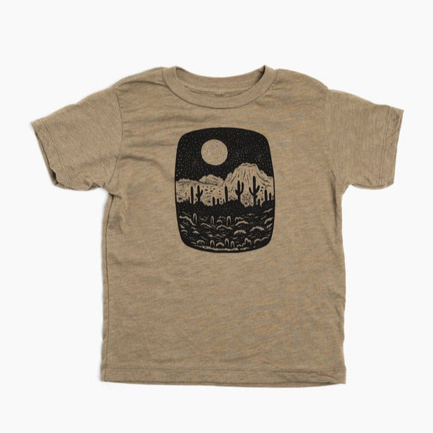 Tan toddler tee with a desert night scene silhouette inside a rounded rectangle