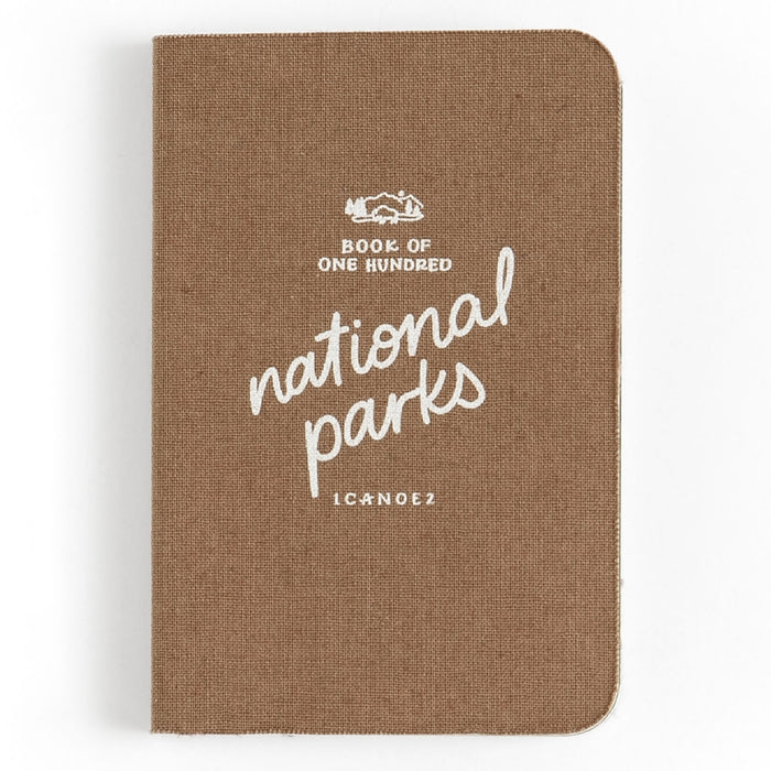 Brown fabric covered One Hundred National Parks Journal with white script title.