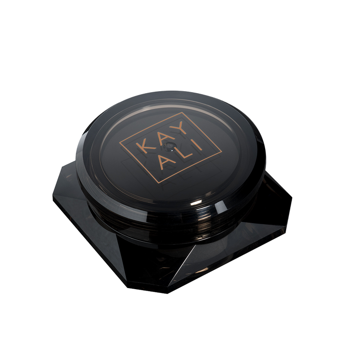 Black cosmetic compact with 'KAYALI' branding on a white background