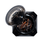 Black container with lid featuring a brand logo, filled with dark brown sticks on a white background.
