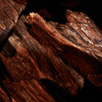 Close-up of oud sticks with a dark background
