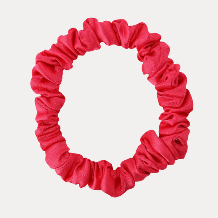 a red scrunchie on a white background