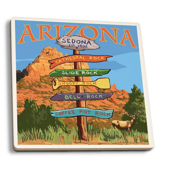 Coaster showing a Sedona Arizona signpost against a desert landscape with rock formations and a deer.