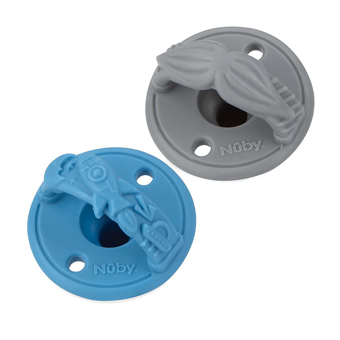 The Nuby Sili Soother Pacifier (2 Pack) includes a gray pacifier with a raised mustache design and a blue pacifier with lips and mustache details, combining comfort and playful style for your baby.