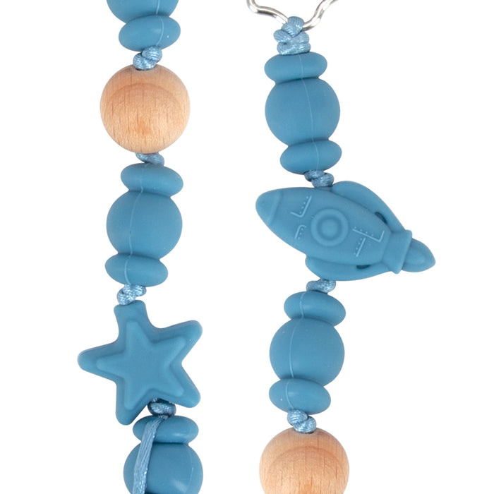 The Silicone and Wood Beaded Pacifier Clip features silicone and wooden beads, including a blue star bead and a rocket bead, all strung on a blue cord.