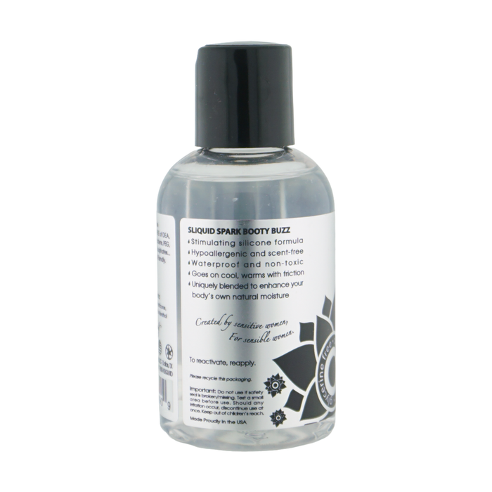 Back label view of the clear bottle detailing product features for Sliquid Spark Booty Buzz, including its stimulating silicone formula, hypoallergenic qualities, and friction-activated warming.