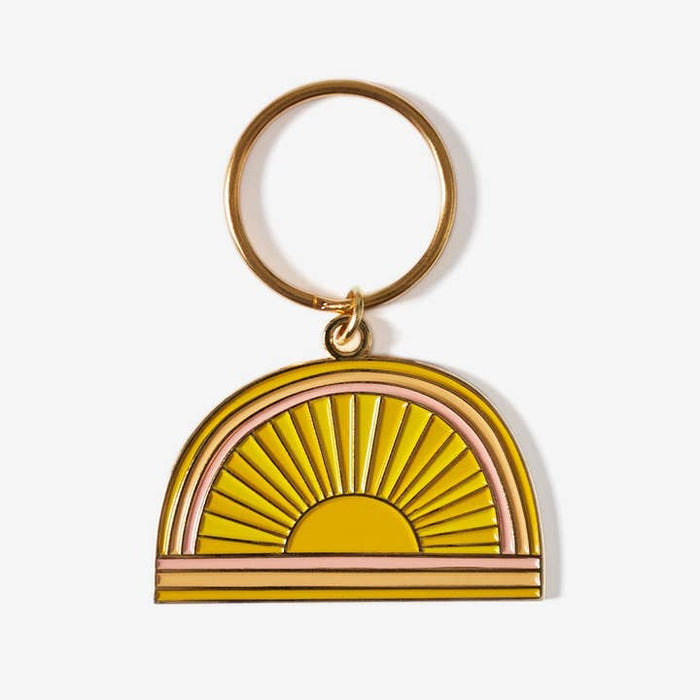 Gold ring keychain with a sunburst semicircle pendant in yellow and pink.
