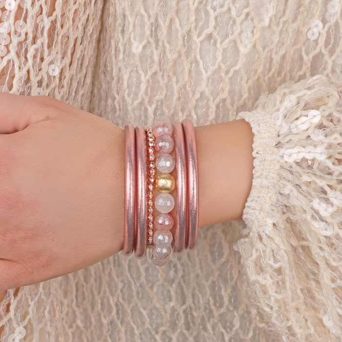 a person wearing bracelets on their wrist