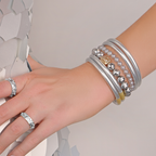 a hand with many bracelets