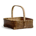 Silhouetted angled image of square toradake bread basket with handle by Kohchosai Kosuga against white background.