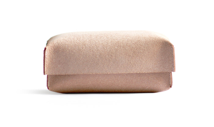 Silhouetted Hender Scheme Leather Two Piece large box against white background.