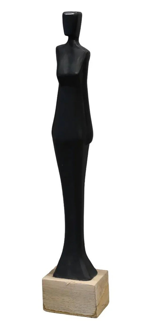 A black sculpture of a standing lady with a wooden base.